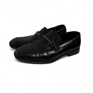 Black leather loafers with silver